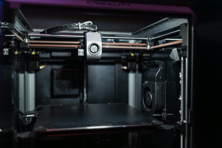 Close-up view of a modern 3D printer interior showcasing advanced technology.