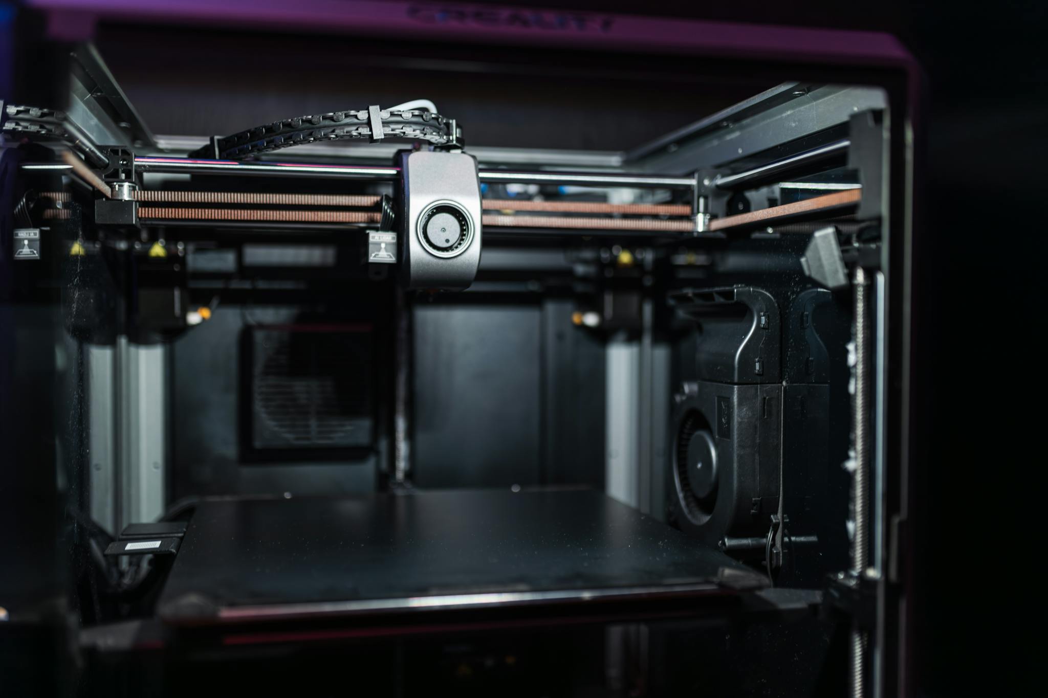 Close-up view of a modern 3D printer interior showcasing advanced technology.